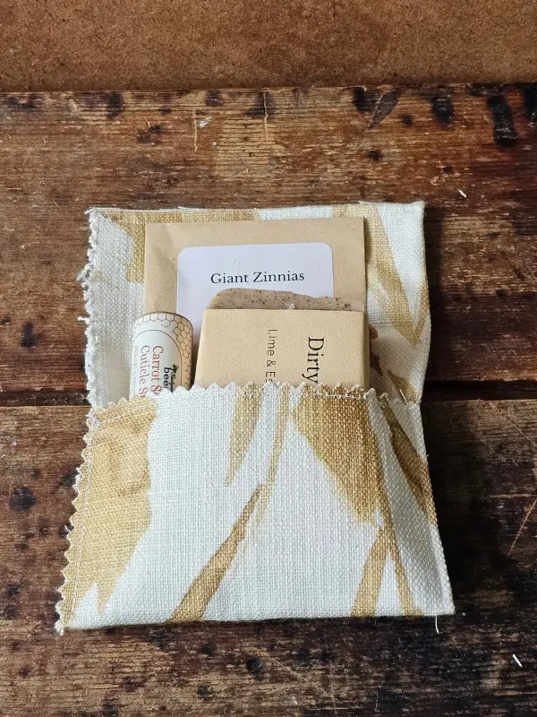 For the Gardener gift set in an open fabric envelope with Dirty Hands soap, cuticle stick, and zinnia seeds