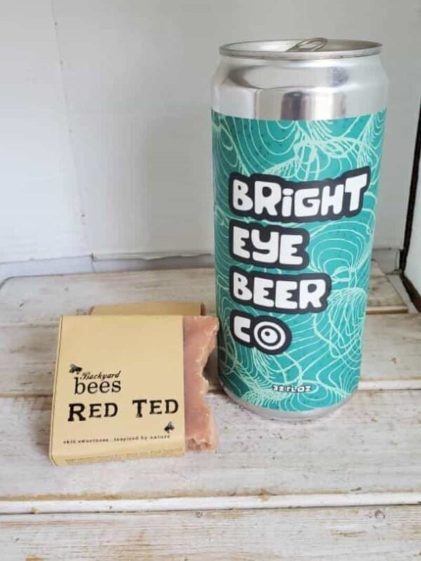 bar of Red Ted beer soap next to tall can of Bright Eye Beer Co can