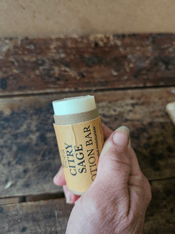 Citry Sage solid lotion bar held in hand