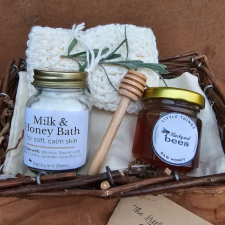 Raw honey and wooden dipper from the ritual set, ready to sweeten tea or the bath.