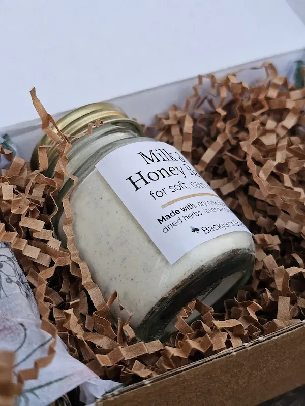 Close-up of handcrafted Milk & Honey Bath soak with natural ingredients for soft, calm skin.