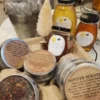 3 different size jars of honey displayed with tea options for tea and honey bag