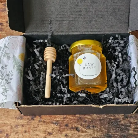 Rosh Hashanah gift box with raw Long Island honey, wooden honey dipper and botanical tissue