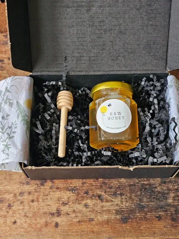 Rosh Hashanah gift box with raw Long Island honey, wooden honey dipper and botanical tissue