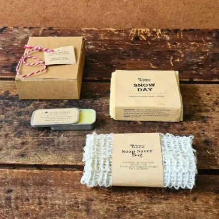 Snow Day Flat Lay Snow Day gift set with peppermint soap, sisal soap saver and Rose Kisses lip balm