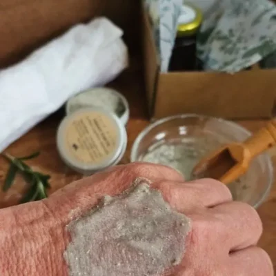 Close-up texture of the natural herbal face mask applied to skin.