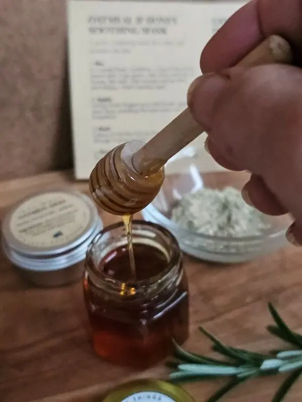Drizzling raw honey included in The Cleopatra Kit for nourishing facial treatment