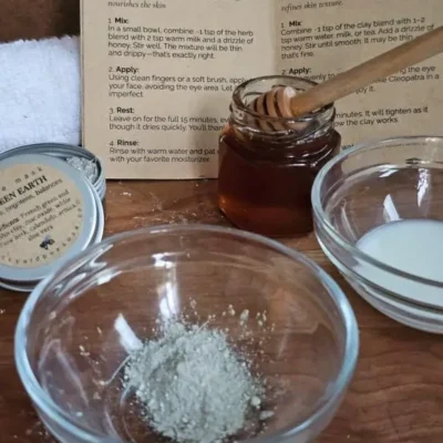 Mixing the herbal face mask with warm milk and honey.