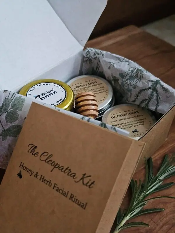 Unboxing The Cleopatra Kit - honey, herbal masks, and facial ritual booklet inside kraft box.