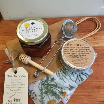 Honey, tea, and accessories on wood