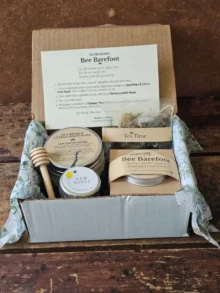 Open Bee Barefoot gift box with foot soak, Honey Loofah Soap, foot balm, raw honey, tea, and ritual card