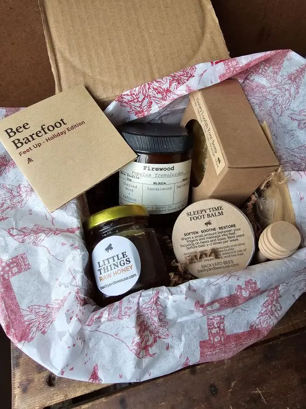 bee barefoot holiday edition recycled box with vintage red tissue paper filled with natural foot care treats