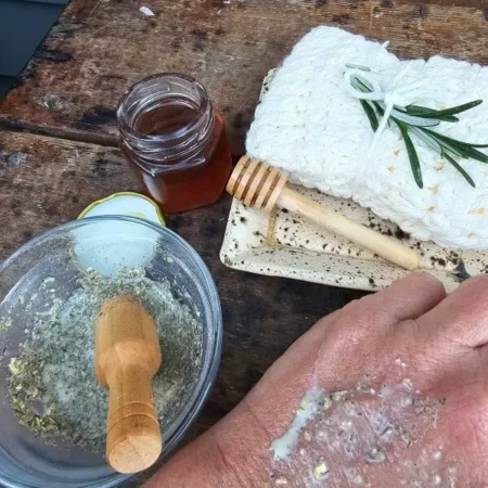 Oatmeal herb honey facial mask mixture, close up of texture, applied to hand