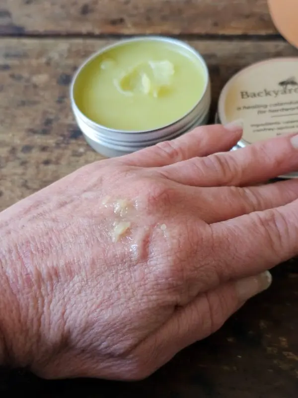 Backyard Balm Salve In Use Backyard Balm calendula comfrey salve applied to dry hardworking hands
