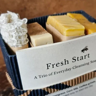 Fresh Start Closeup Box Fresh Start natural soap gift set with three handmade cleansing bars and reusable sisal soap saver bag in navy upcycled box