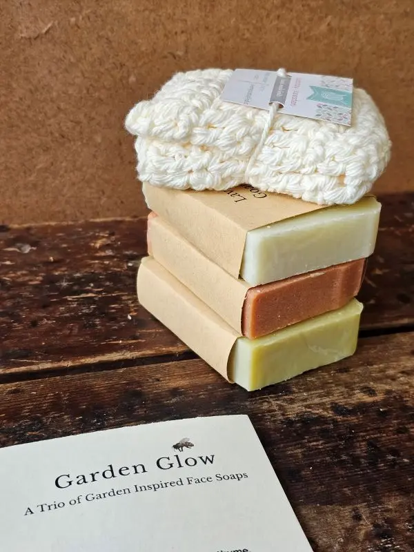 Stacked botanical facial soap bars with hand crocheted organic cotton face cloth
