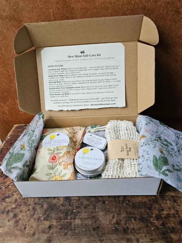 Backyard Bees new mom gift box with handmade self-care items including eye pillow, nursing balm, lip balm, herbal salve, and soap saver