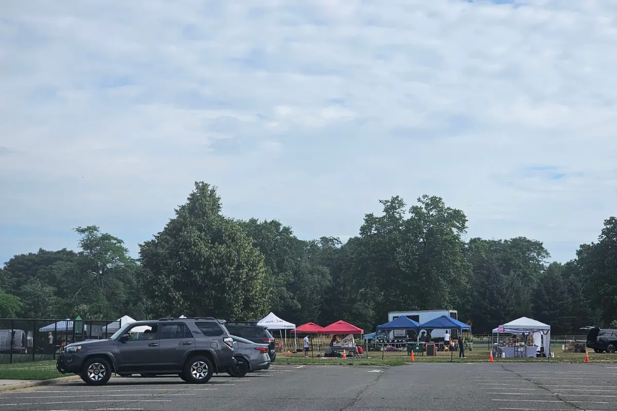 Morning set-up of tents at Eisenhower Park Farmers Market