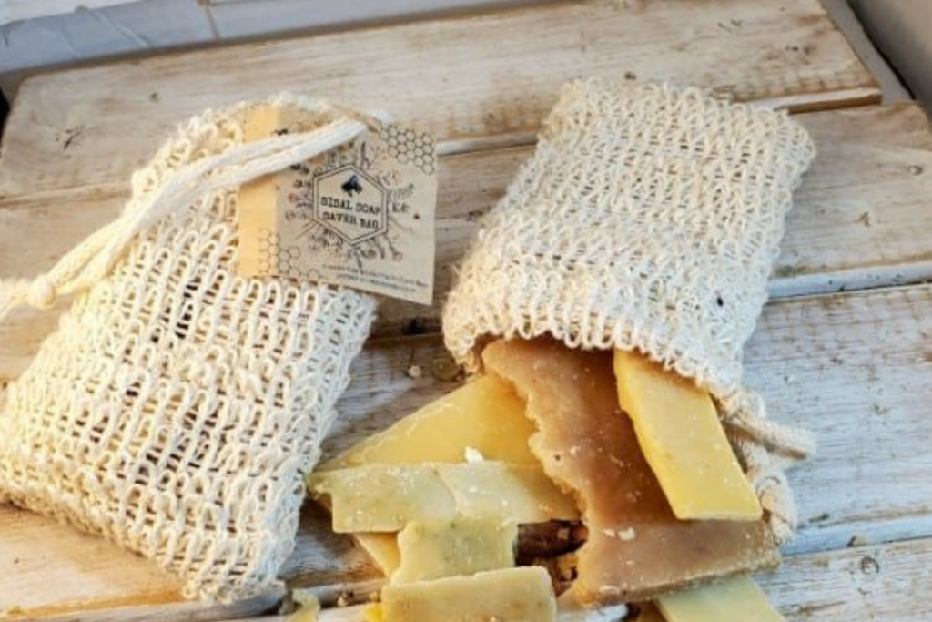 Prefilled reusable sisal soap saver bags opened to show soap shreds content
