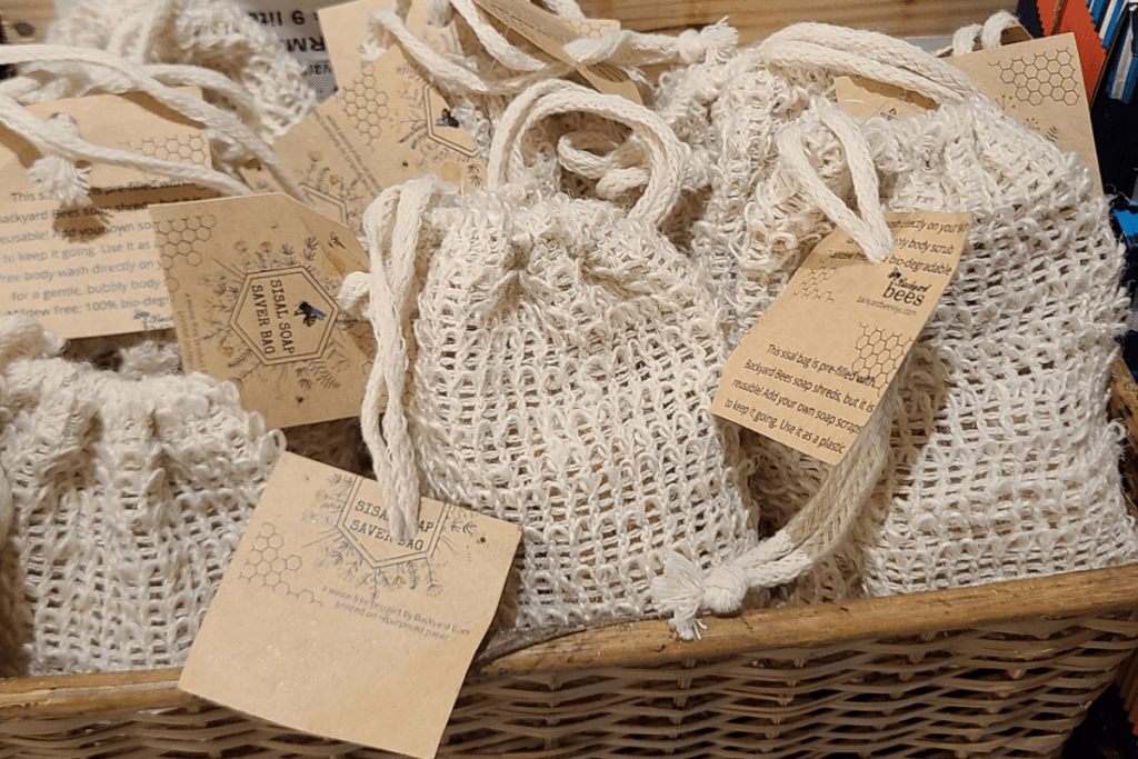market display of Backyard Bees soap saver bags in a basket
