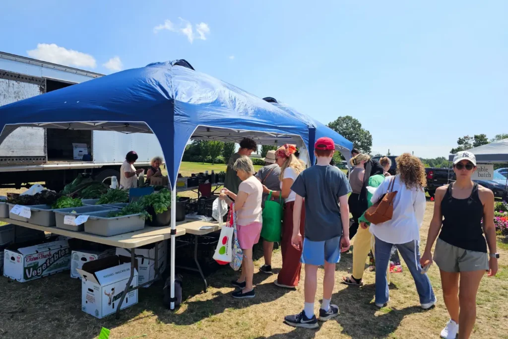 Customers shopping at the Eisenhower Park Farmers Market during Sustainability Saturday