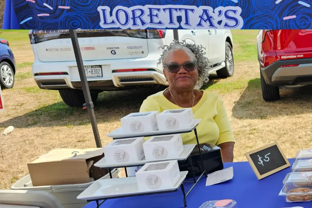 Loretta at her bakery stand with her signature baked goods at the Eisenhower Park Farmers Market