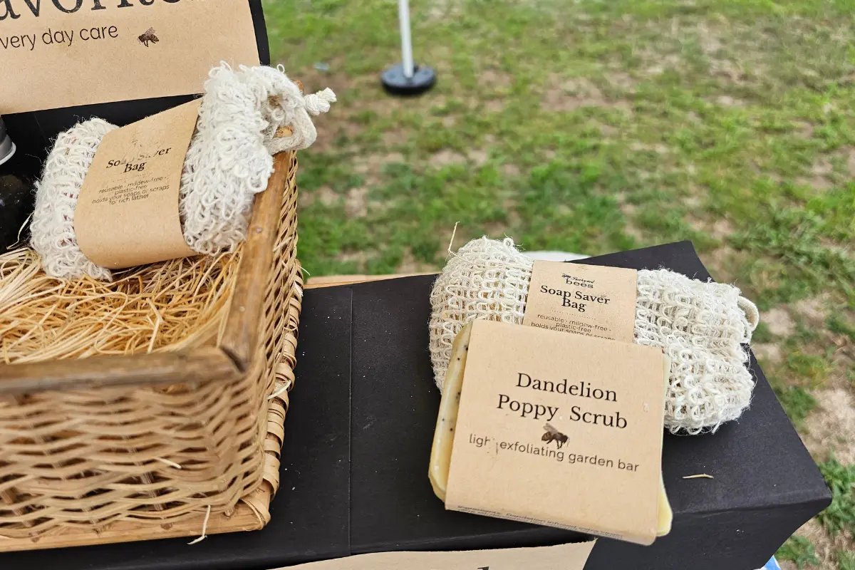 Handmade soap saver bag with Dandelion Poppy soap at the Backyard Bees farmers market