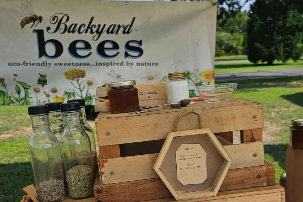 ackyard Bees display featuring a traditional milk and honey facial demonstration at the CCE Farmers Market in Eisenhower Park.