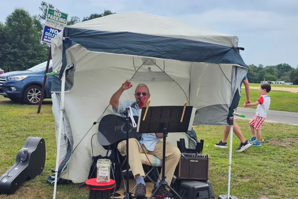 Gary performs live music during the Saturday CCE Farmers Market in Eisenhower Park.