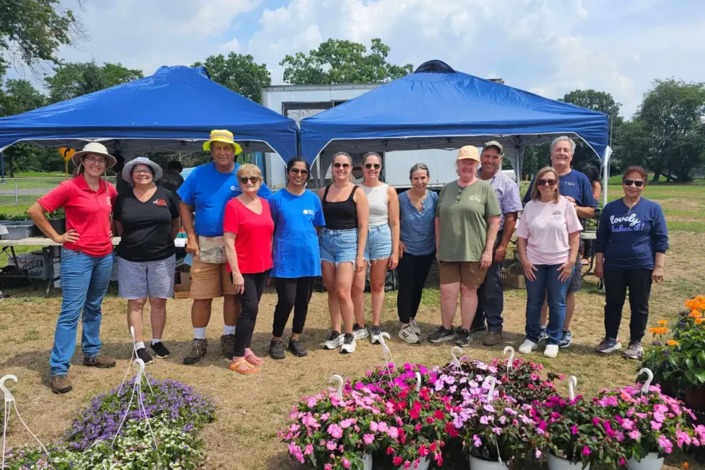 The Hive 8 Vendors gather to celebrate National Farmers Market Week at the CCE Farmers Market in Eisenhower Park.