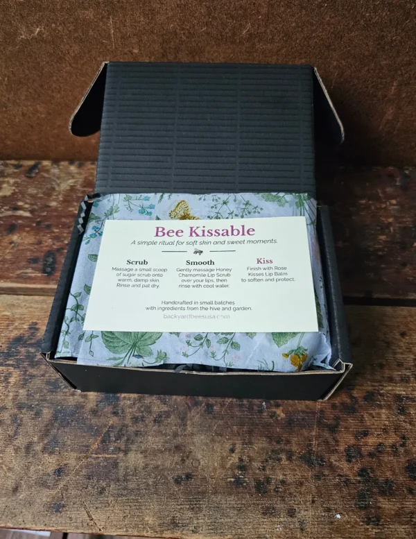 Open Bee Kissable gift box showing botanical tissue paper and skincare ritual insert