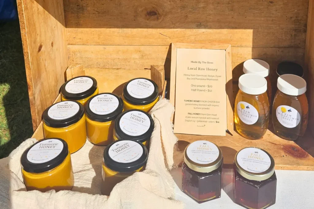 Turmeric honey and other Backyard Bees products displayed at the farmers market