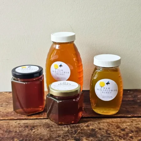 4 sizes of Backyard Bees local North Shore honey displayed together