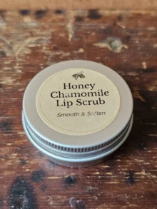 Backyard Bees Honey Chamomile Lip Scrub in closed silver tin with with kraft label