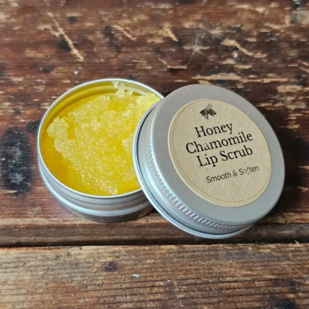 Close-up of Backyard Bees honey chamomile lip scrub texture, with bright yellow sea buckthorn oil