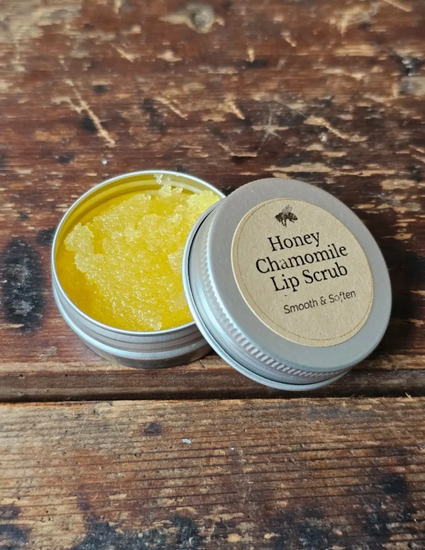 Close-up of Backyard Bees honey chamomile lip scrub texture, with bright yellow sea buckthorn oil