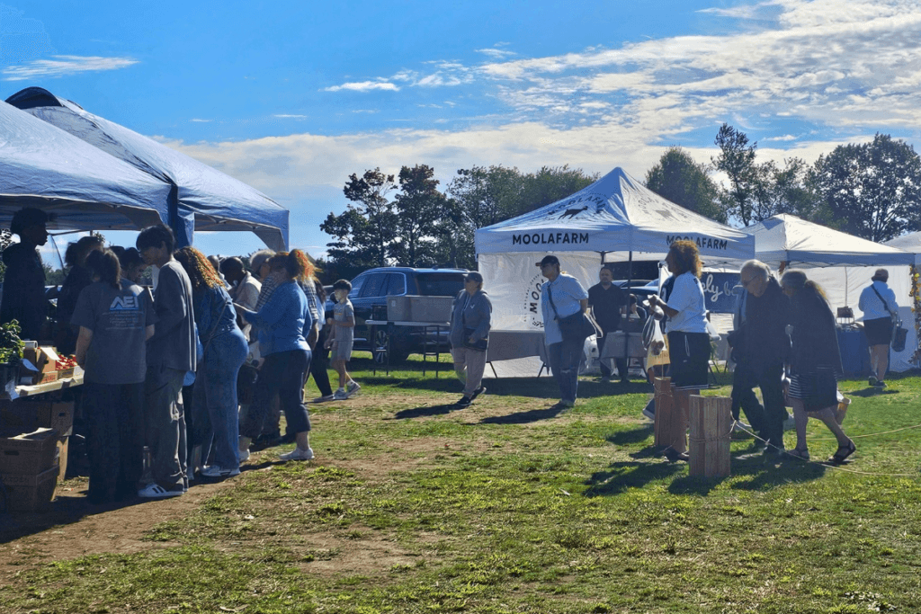 the line at the farm stand at the first October farmers market