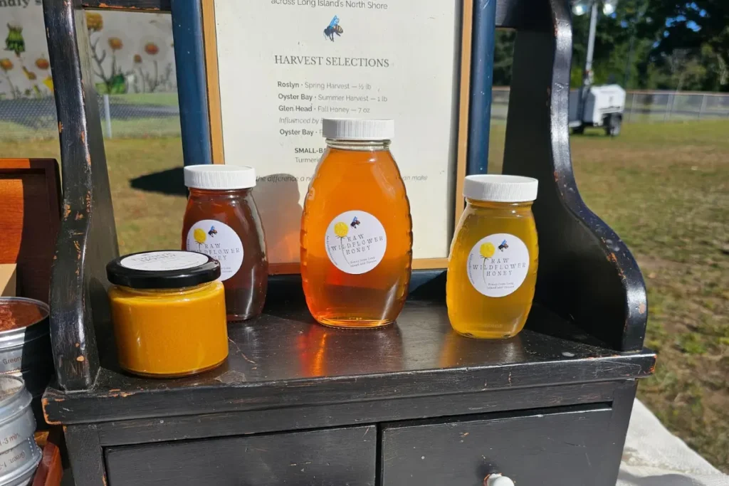 Backyard Bees honey jars and bottles showing harvest colors from pale gold to deep amber.